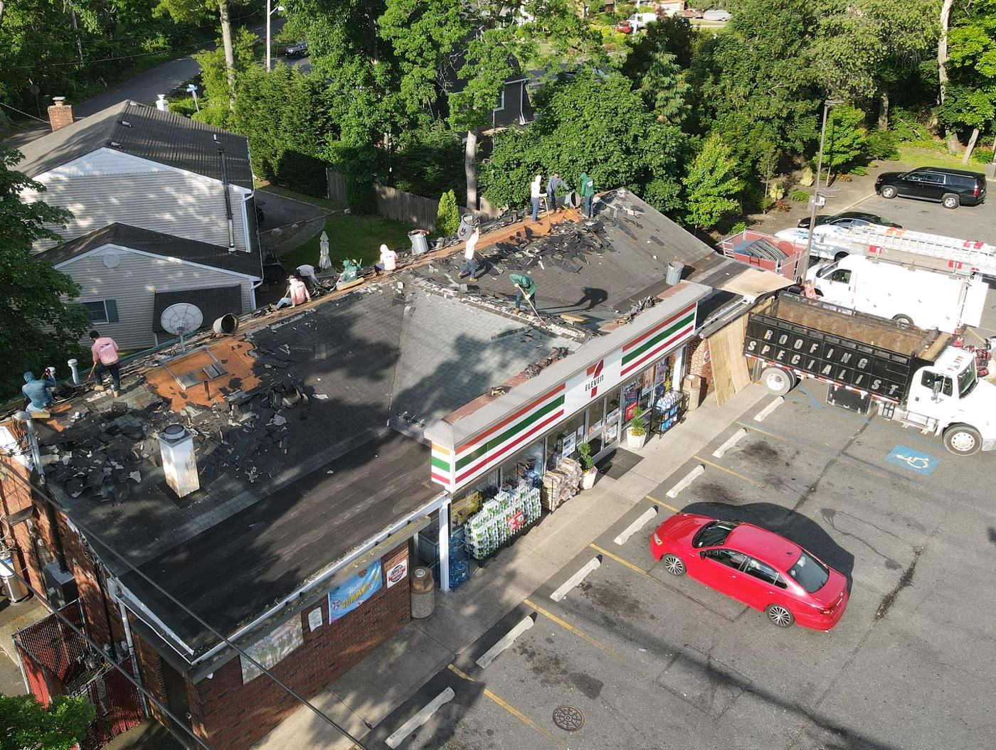 Roof replacement in progress with the crew on site